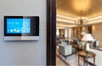 Image of smart home panel on left side with an entry into another room on the right side