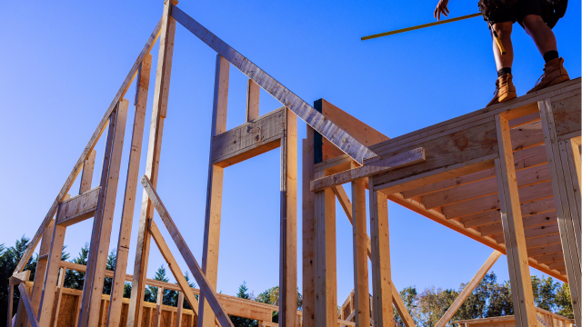 Exposed framing of new home construction showing wire-ready infrastructure